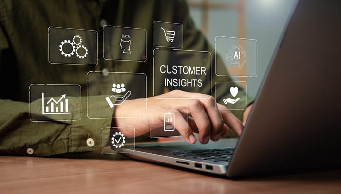 A close-up of a person using customer insight to create strong customer relationships and boost brand recognition.